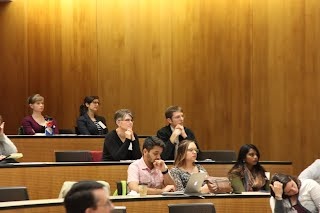 Participants listening to a presentation