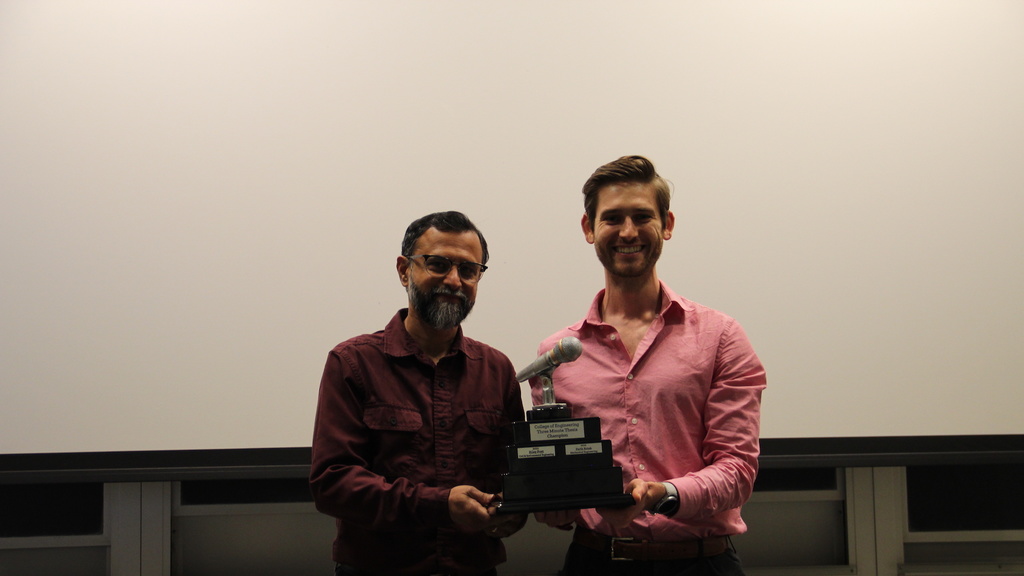Professor Udaykumar presents a trophy to Chris Vidmar